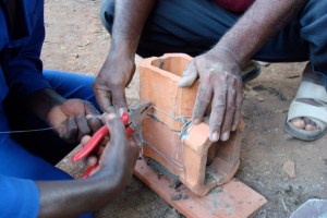 Wrapping tiles with a wire to form a combustion chamber
